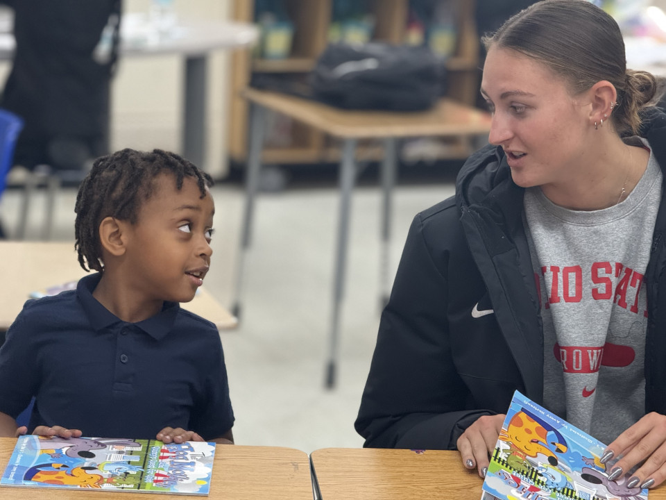Group of Student-Athletes with Child