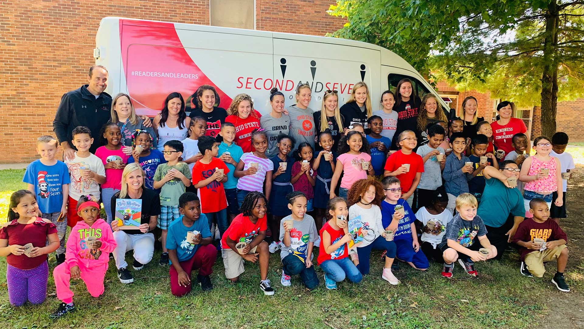 Readers and leaders outside with 2nd & 7 van